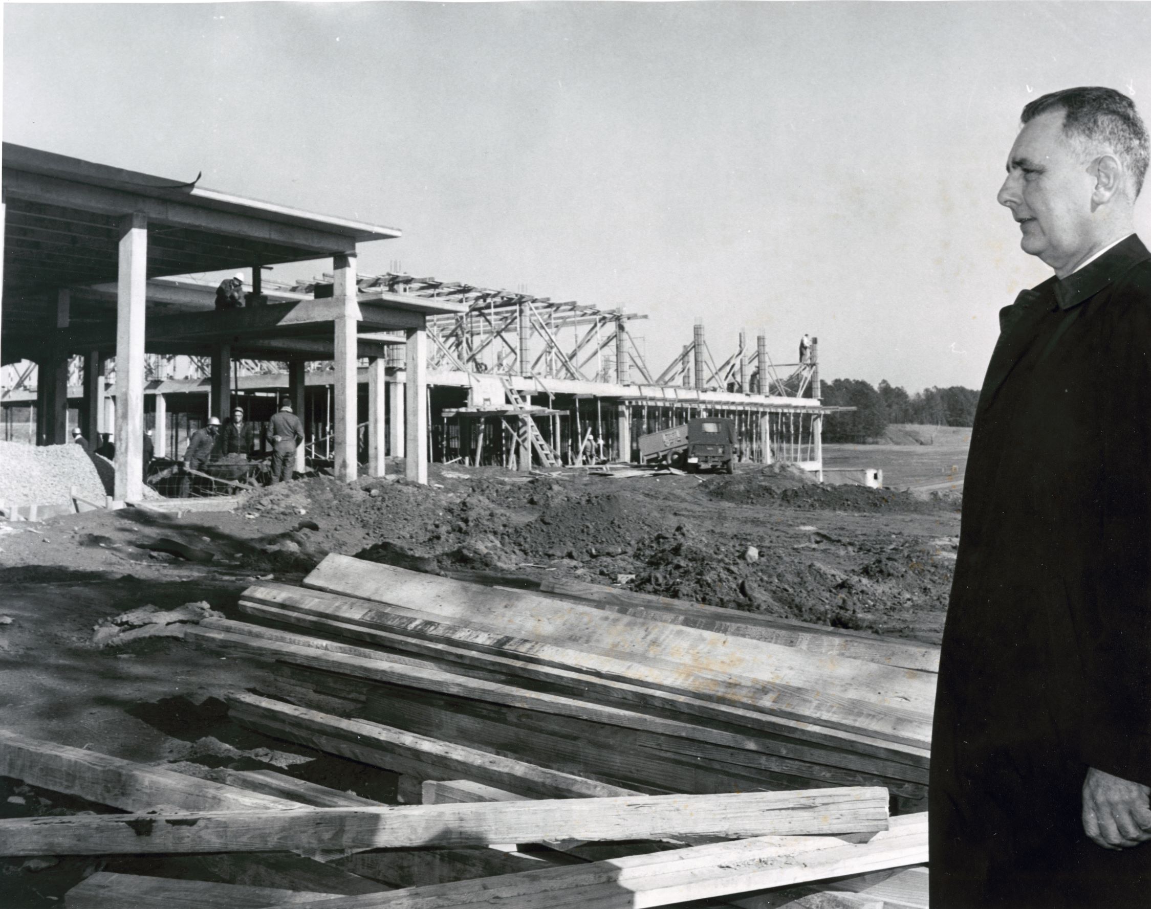 Howard Sturgis looking at library being built