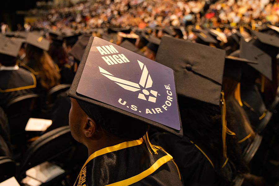 student wearing a u.s air force graduation cap at the ceremony.