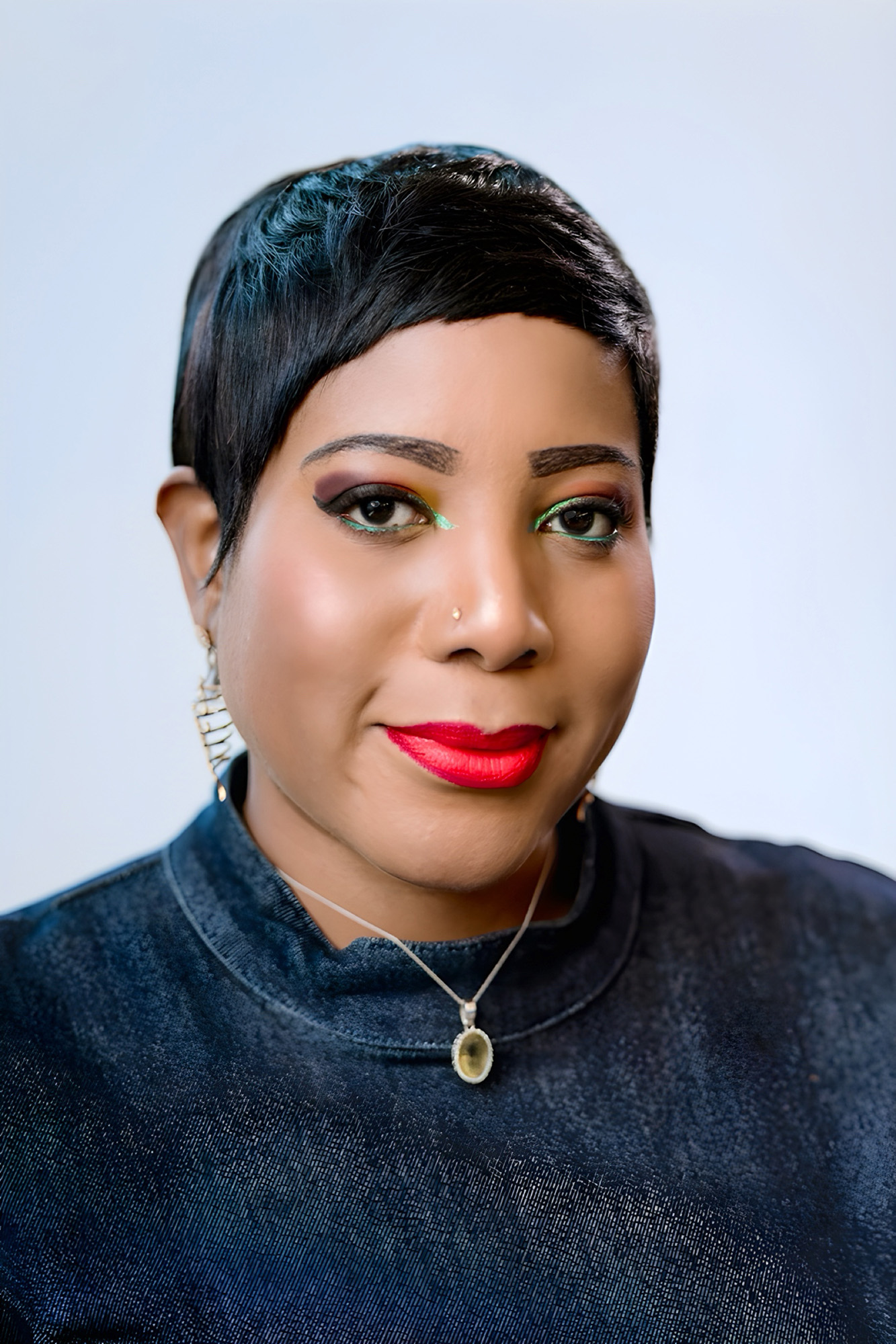 headshot of a woman in front of a white backdrop