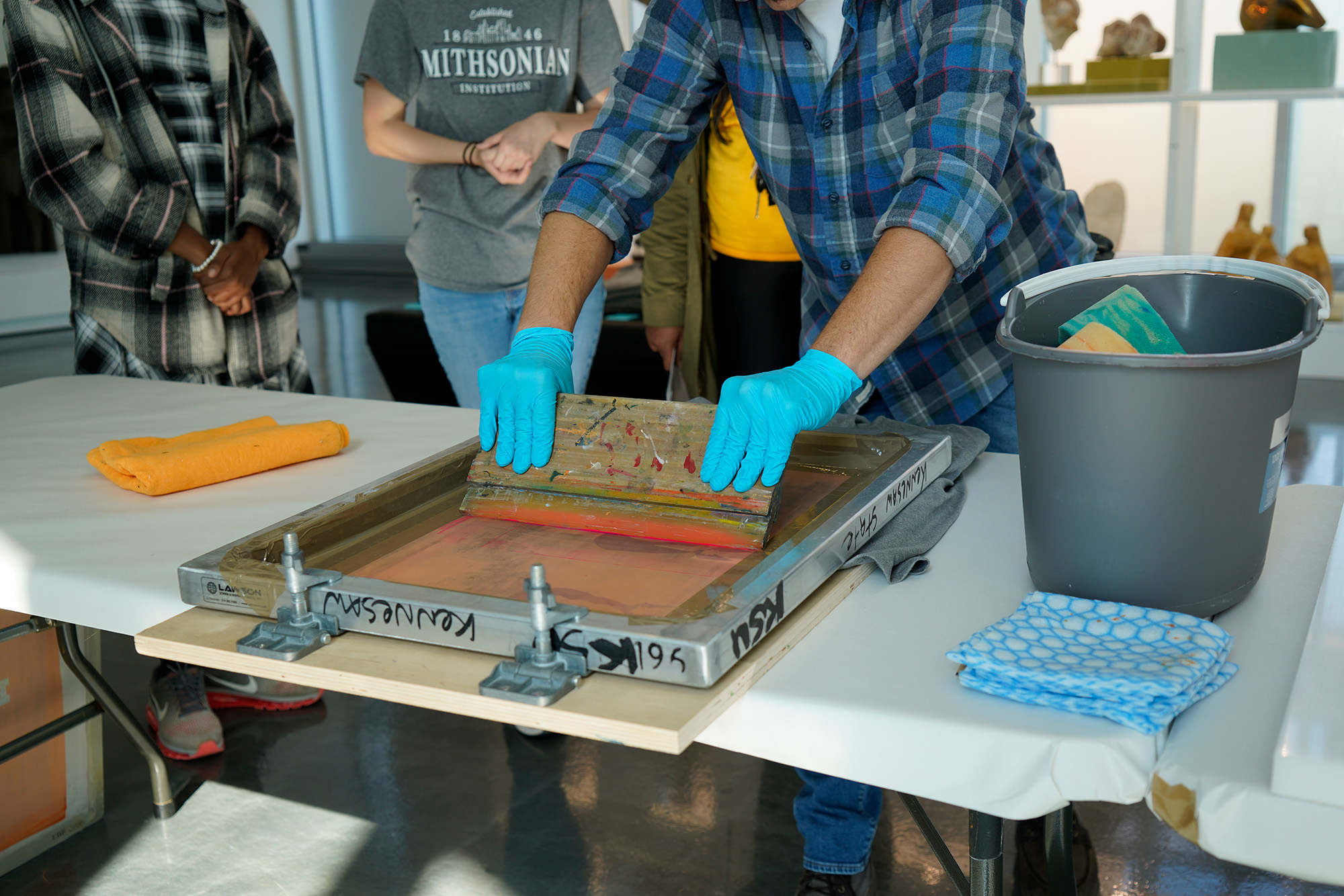 image of a person screenprinting