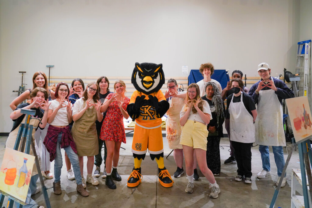 Scrappy with students at the Spring Arts Festival