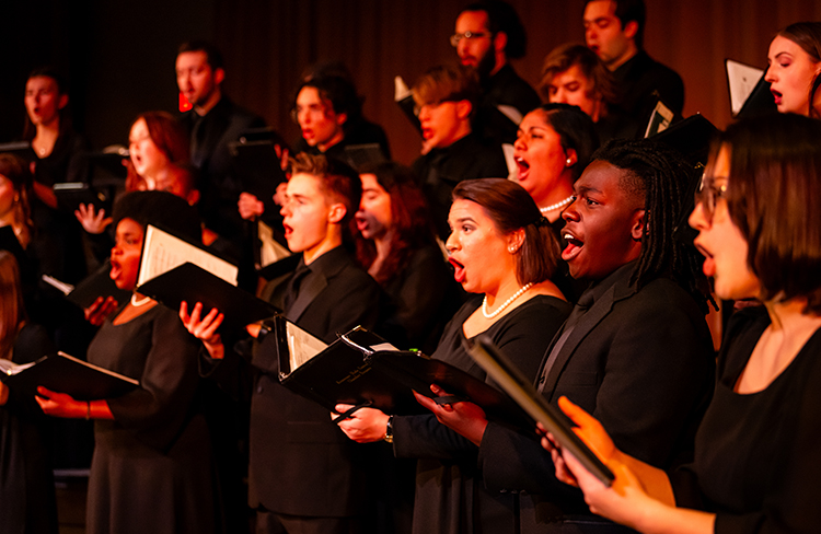 image of students singing on stage