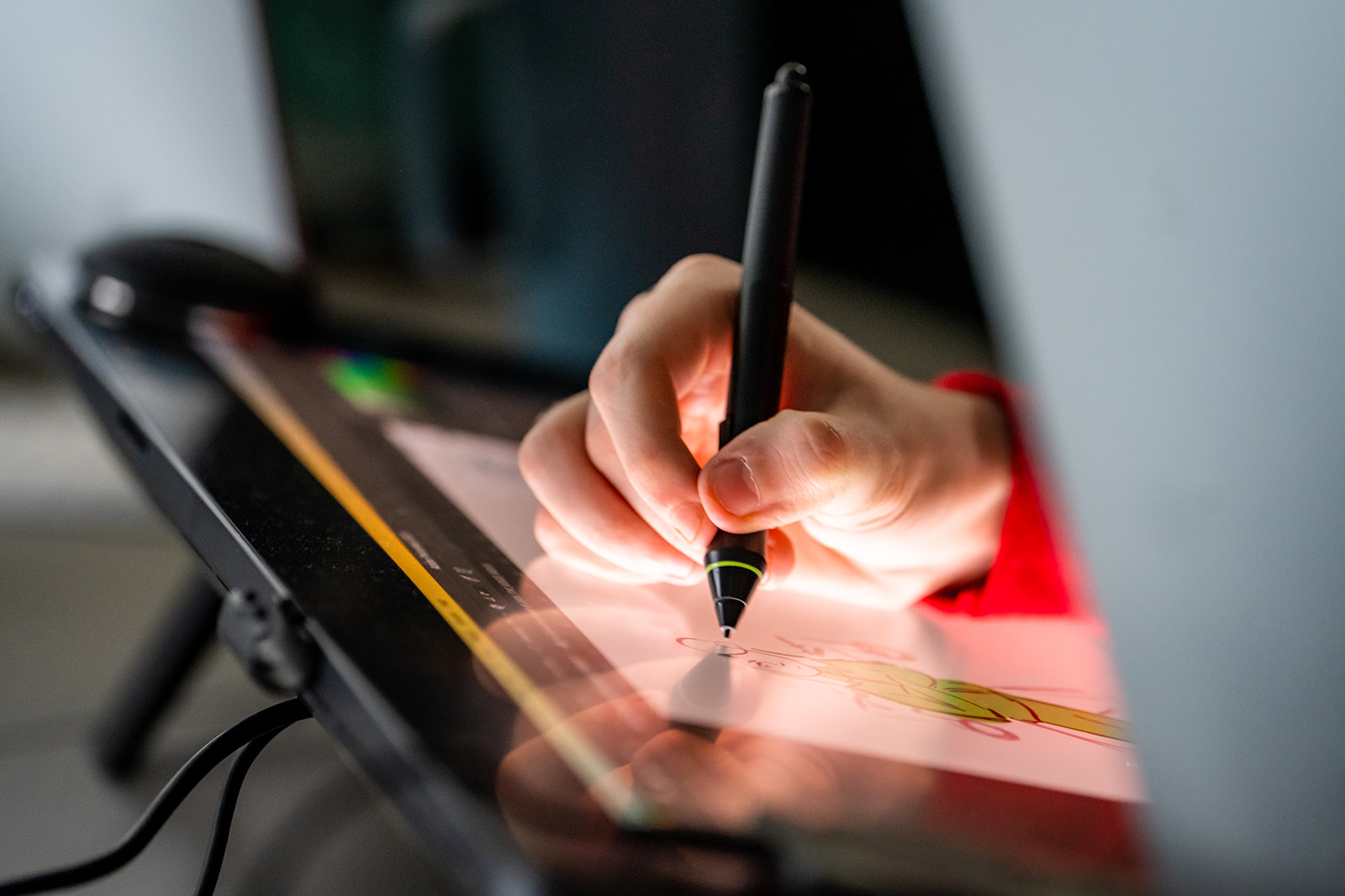 student drawing on tablet