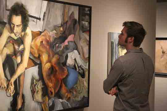  man looking at painting