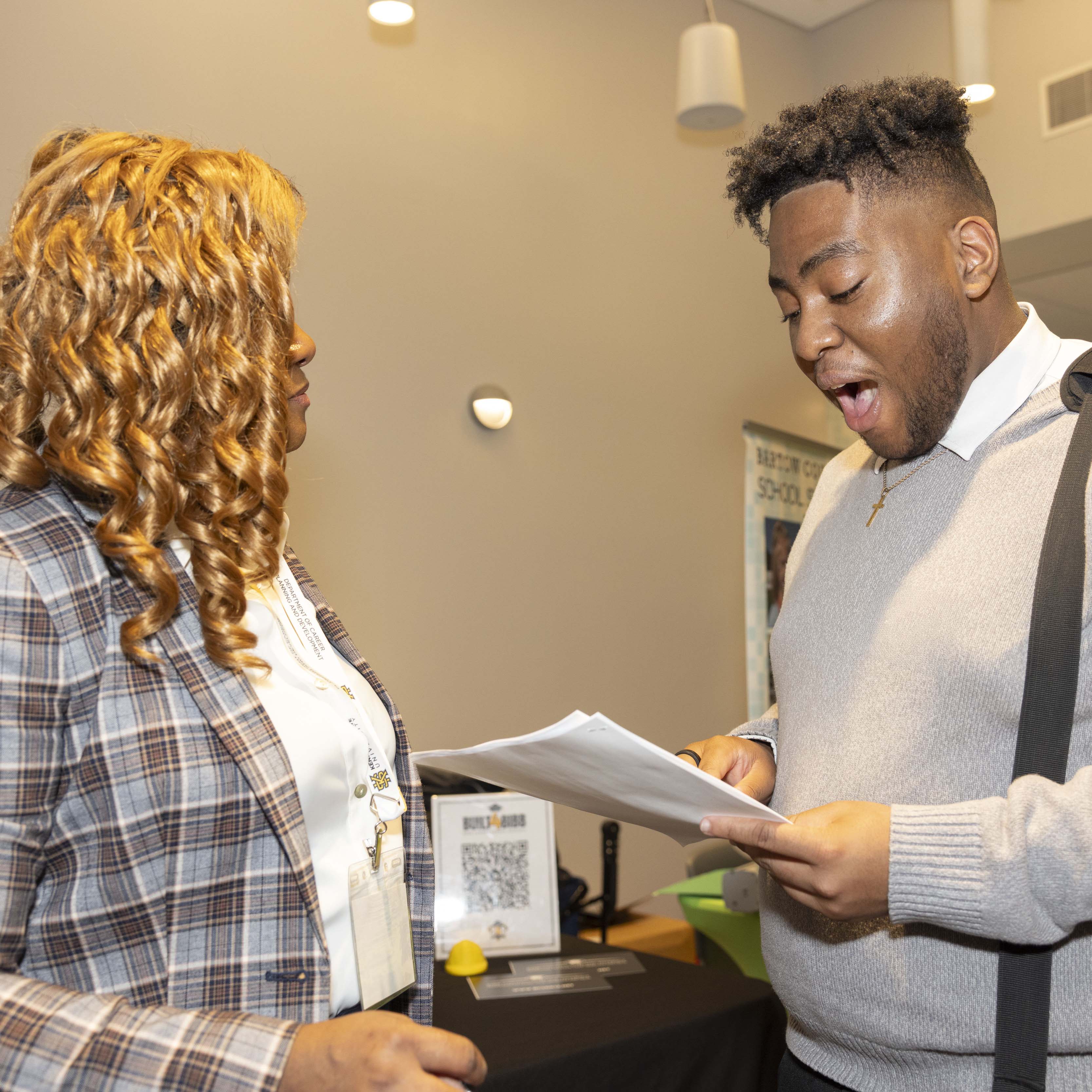 two people discussing a resume