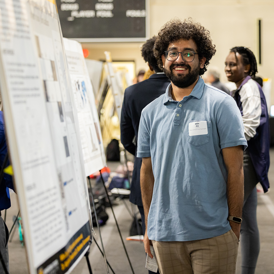 Doctoral candidate Nitin Jha presents research at C-Day Spring 2024. 