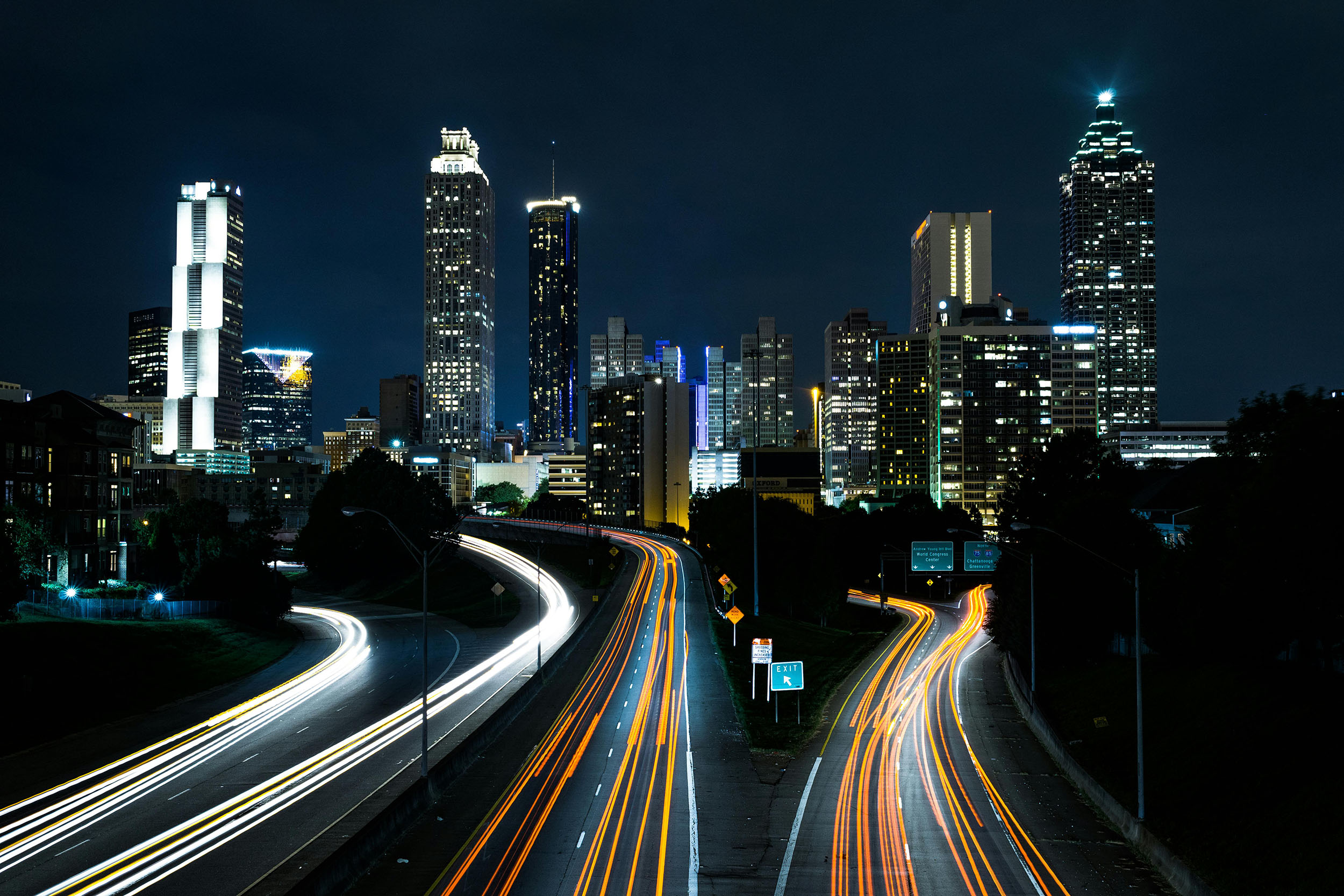 Traffic racing through Atlanta at night.