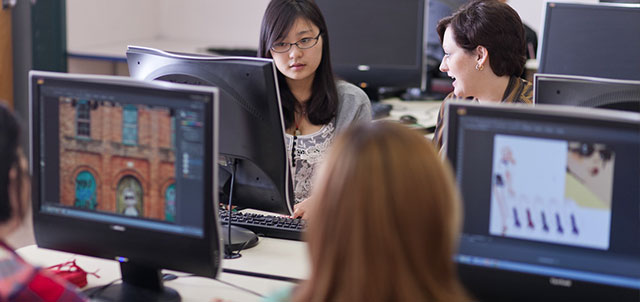 students working together in a computer classroom