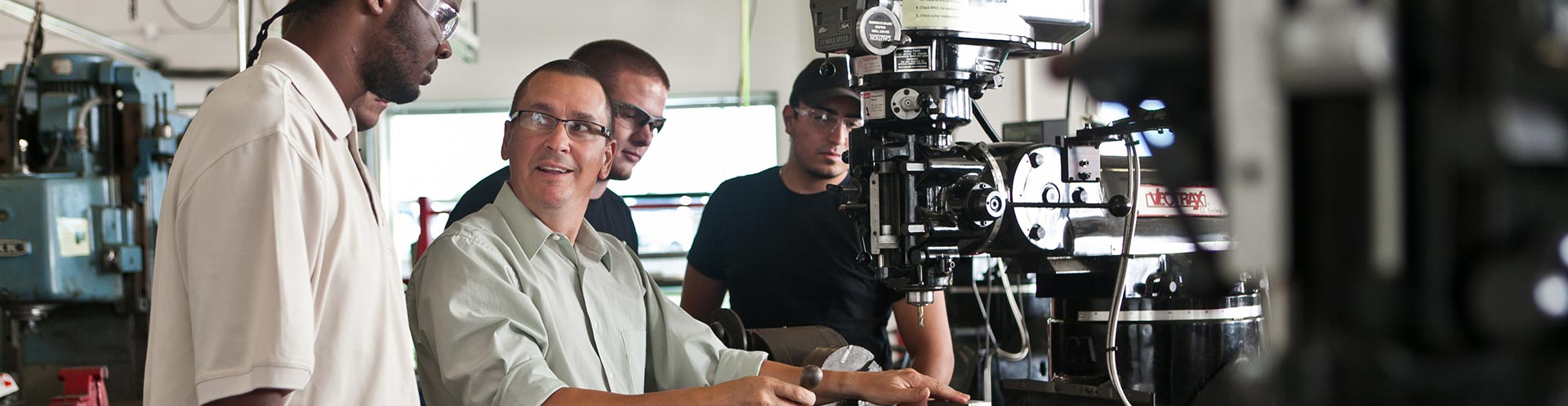 professor working with students in lab