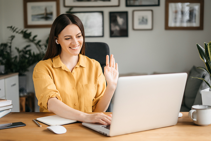 a woman in a virtual meeting on her laptop
