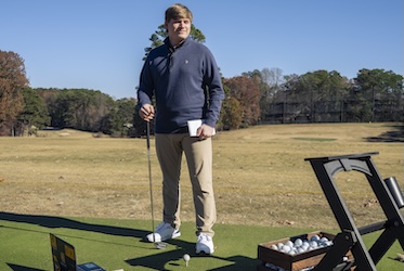 Hospitality Management graduate Colin Jacobs on the golf course