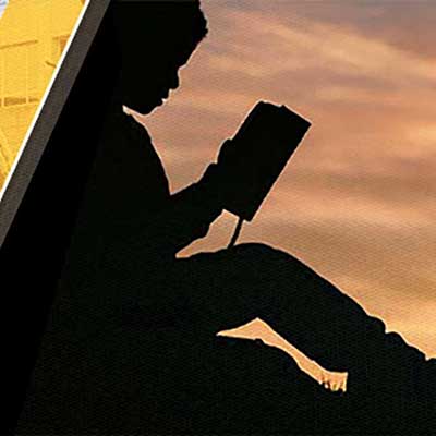 student reading book silhouette