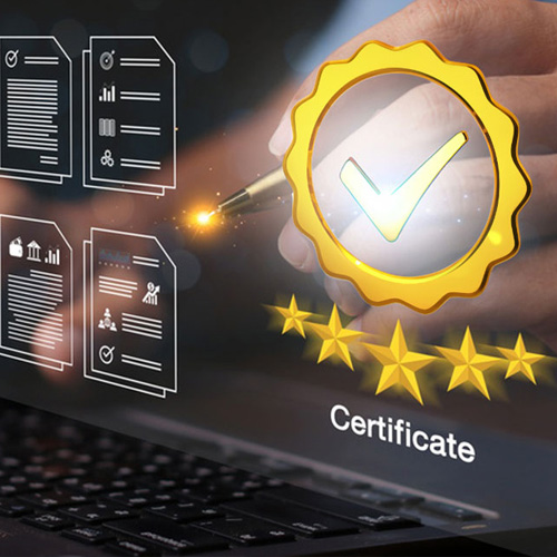 A hand is hovering over a laptop keyboard, holding a pen that is pointing at a golden seal with a checkmark inside. Behind the seal are several documents and five golden stars, with the word "Certificate" displayed below.