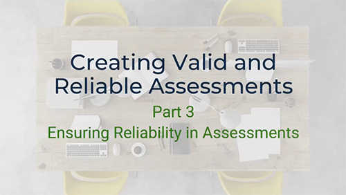 A top-down view of a conference table with a laptop, keyboard, mouse, pens, and papers scattered across it. The text "Creating Valid and Reliable Assessments" and "Part 3 - Ensuring Reliability in Assessments" is written on the table. Two yellow chairs are visible on either side of the table.