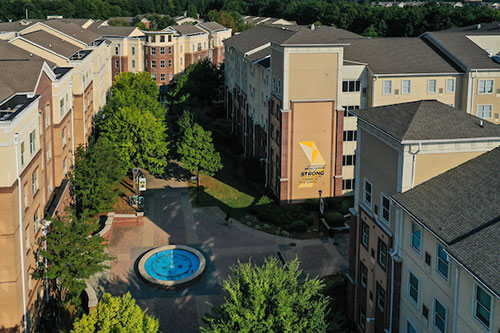 Photo of KSU courtyard with a fountain at the student residence