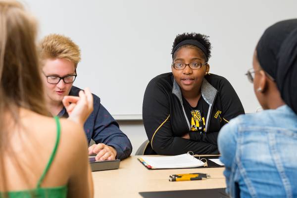 group of ksu students collaborating at a table