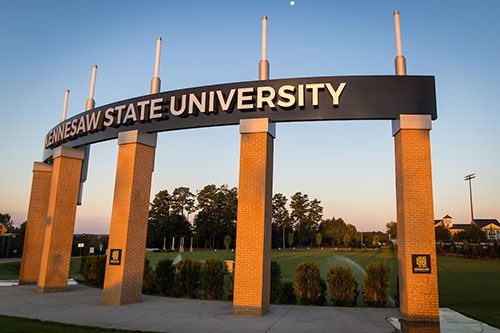 Photo of Kennesaw State entrance sign at sunset