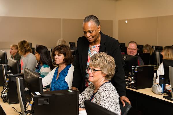 ksu professor helping a student.