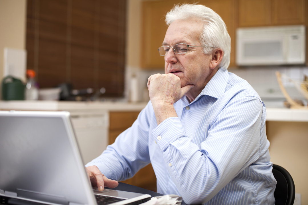 man using laptop at home