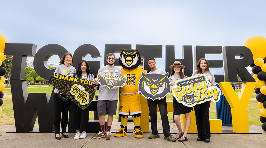 Students with President Schwaig on Giving Day