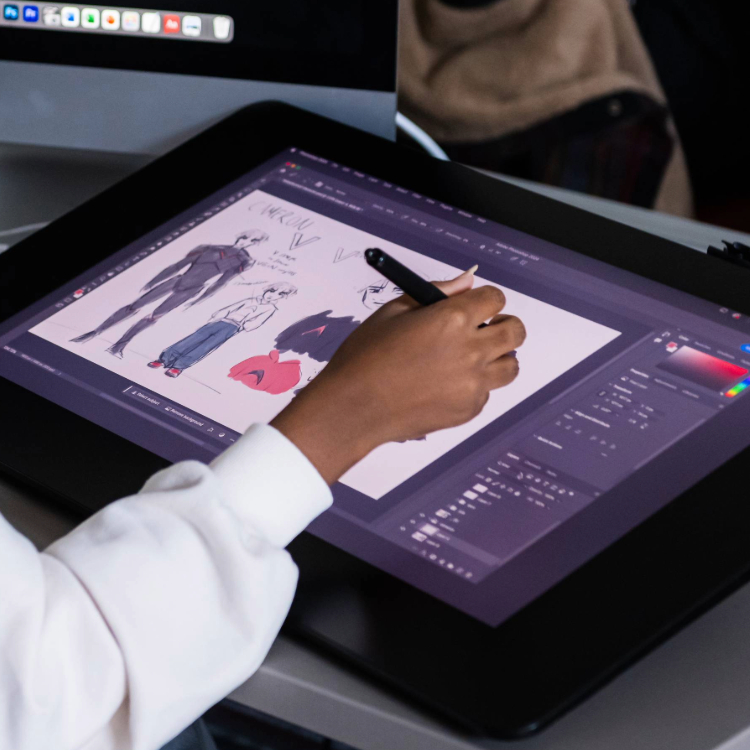 digital animator drawing figures on a tablet device