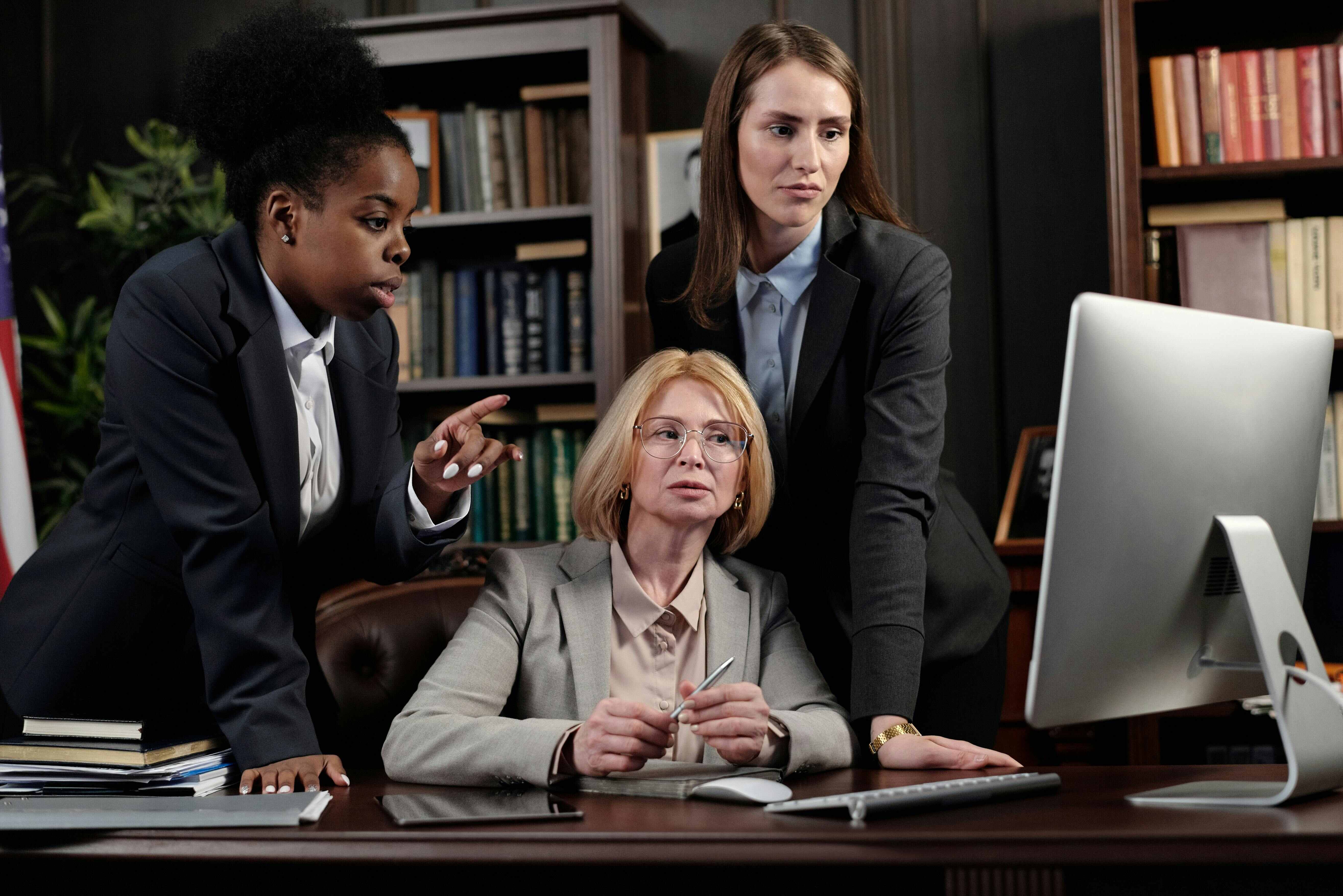 female lawyers reviewing a case file on computer