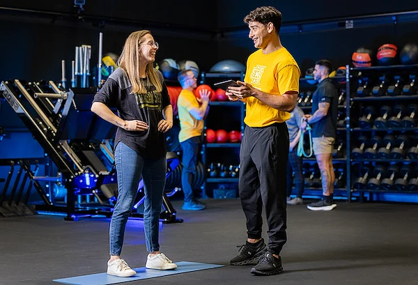 exercise science students in classroom using equipment