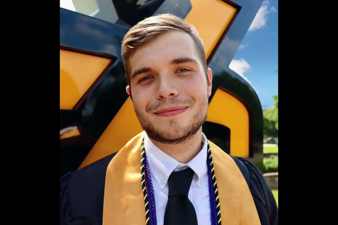 kennesaw state university graduate in cap and gown at graduation