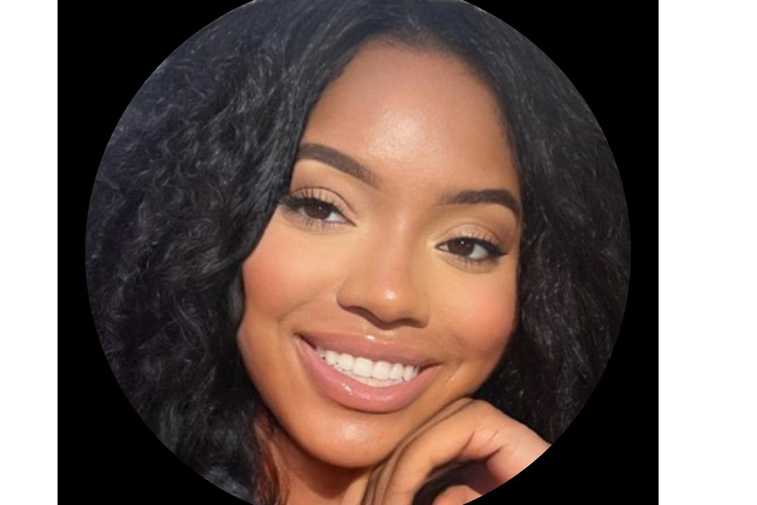 african american graduate student smiling in headshot