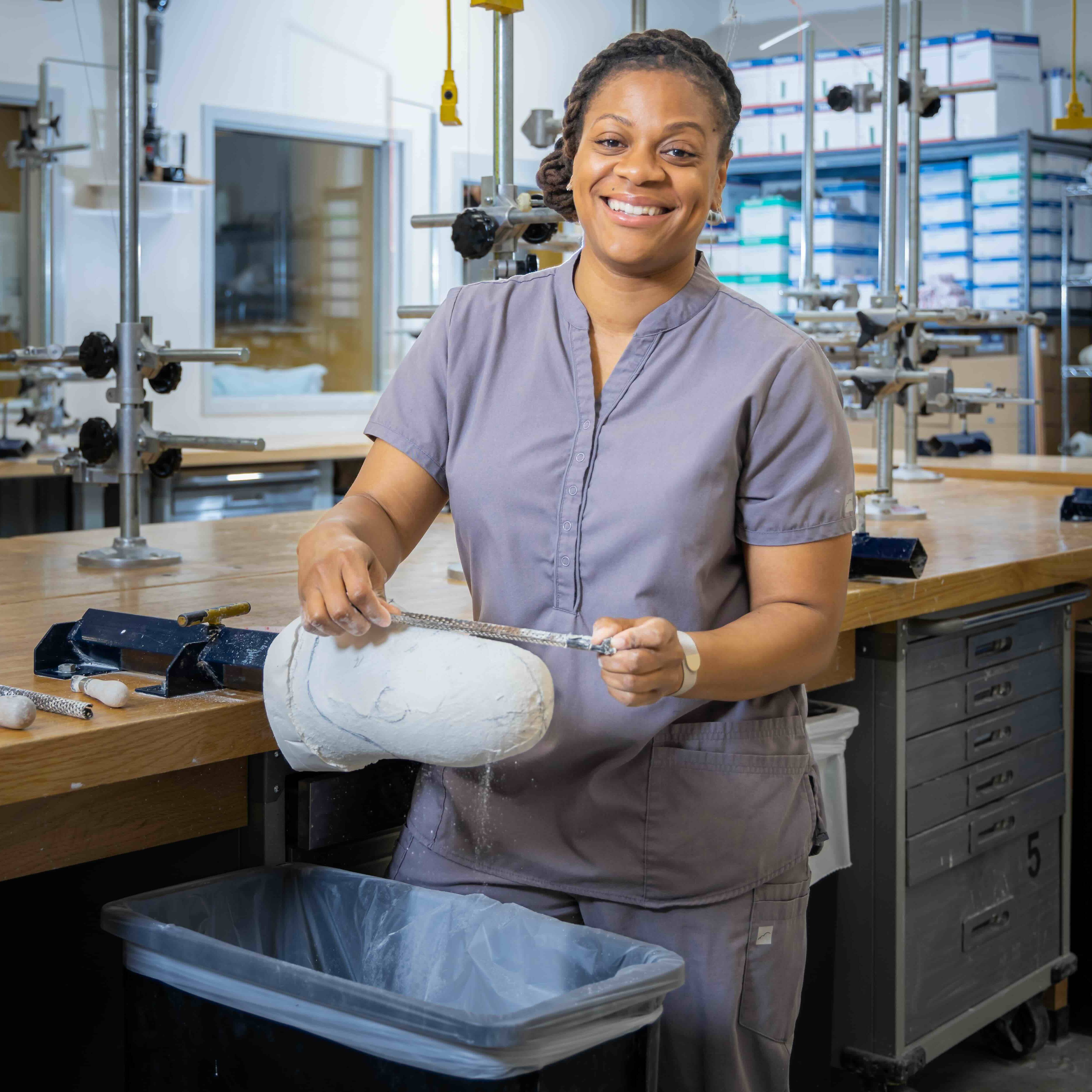 Student working with a mold