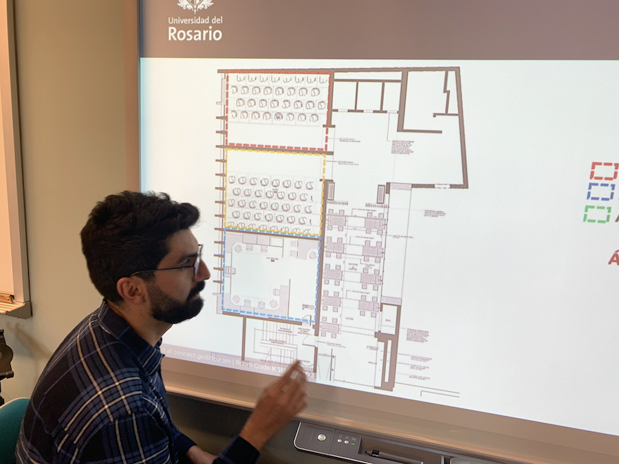 faculty looking at a chart on a projector screen.