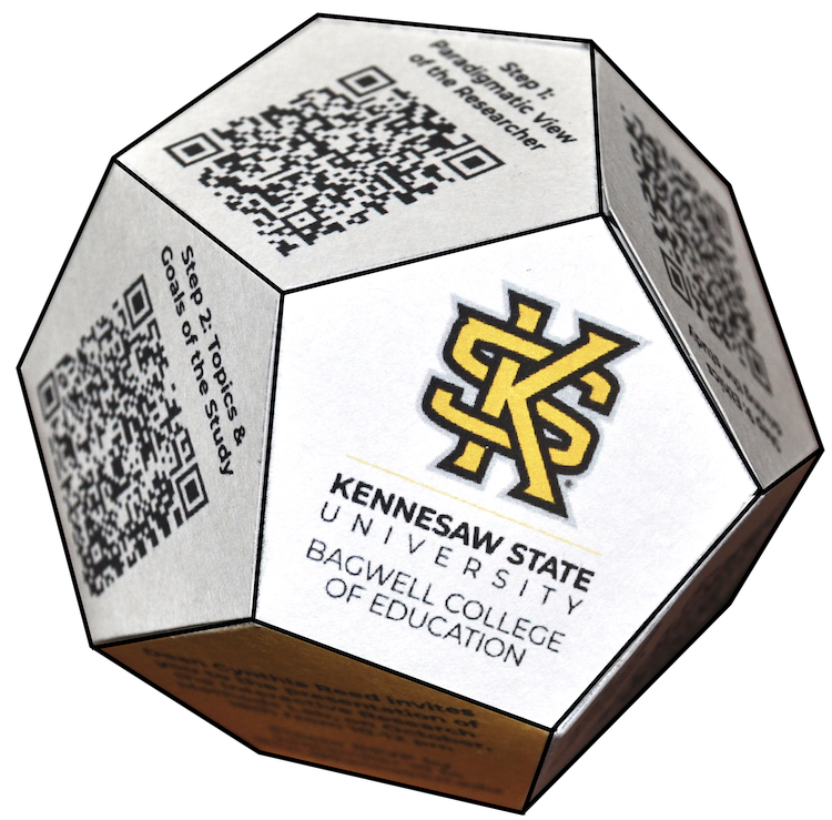 polyhedral die with qr codes on each side with bagwell logo on one of the sides.