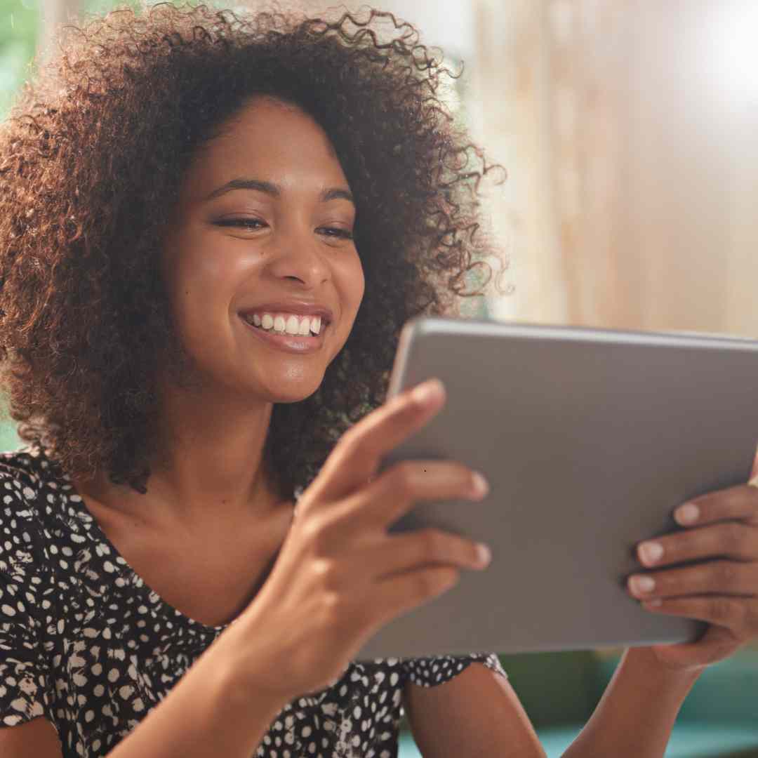 woman looking at ipad