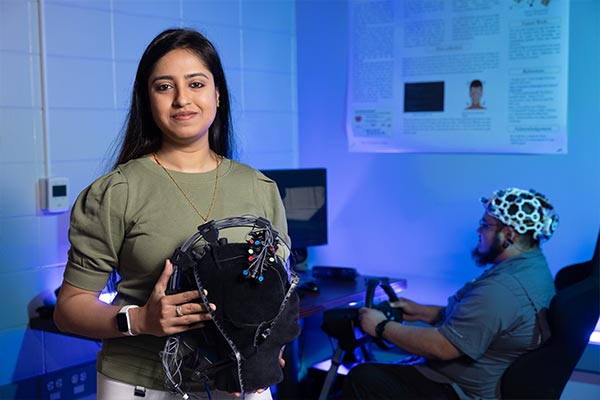 Dr. Sylvia Bhattacharya holding a ai model.