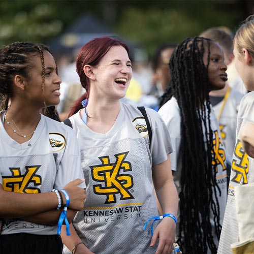 group of first flight students laughing.