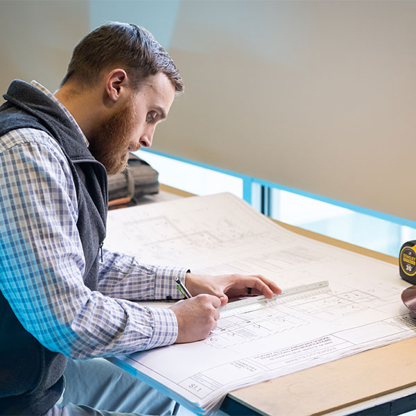 ksu architecture student working on a building design.