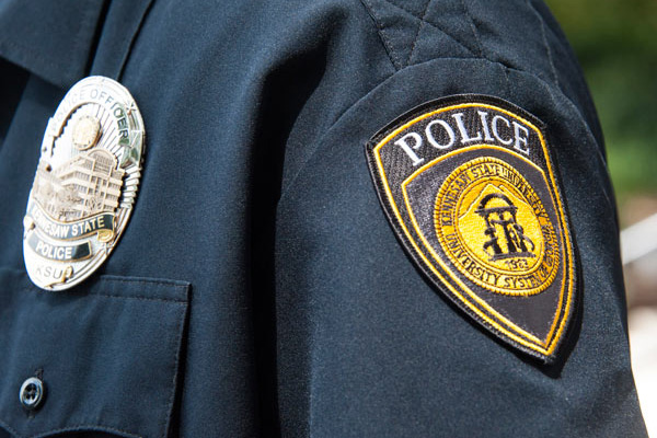 police officer shoulder showing badge and patch