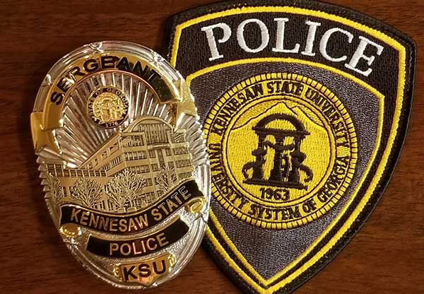 police patch and badge on desk