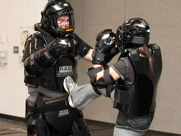 woman in body gear protecting herself