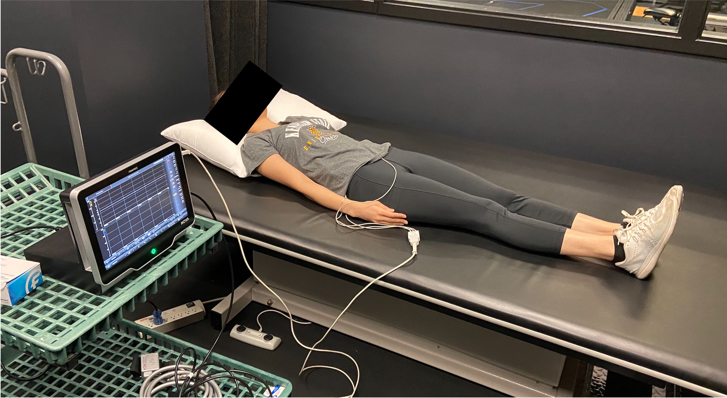 participant on exam bench connected to monitor