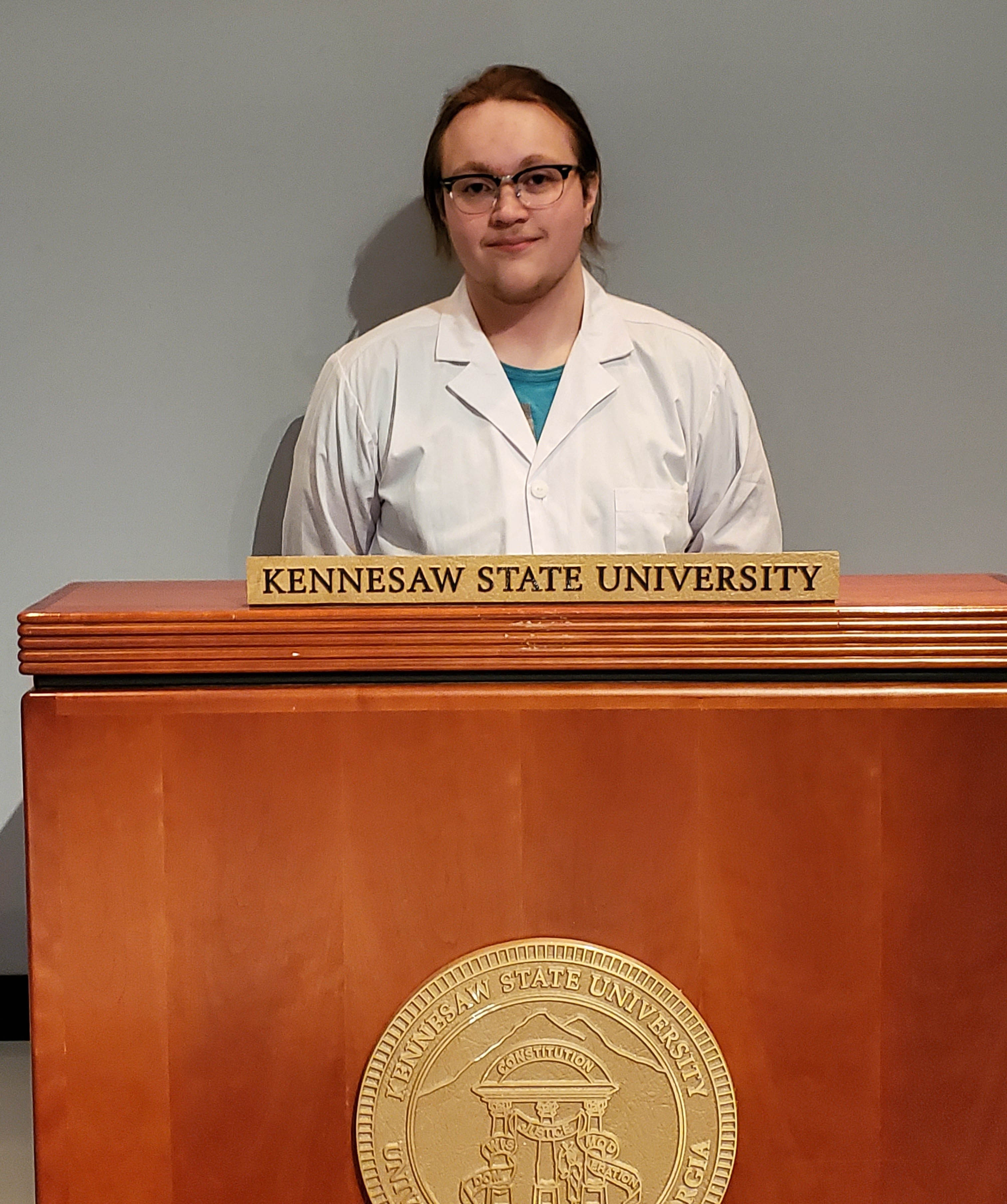 Preston Eldridge standing at a KSU podium