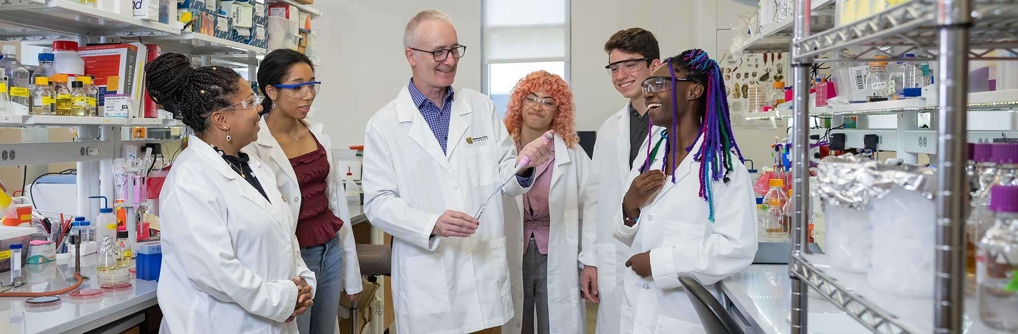 ksu research students in the lab with professor