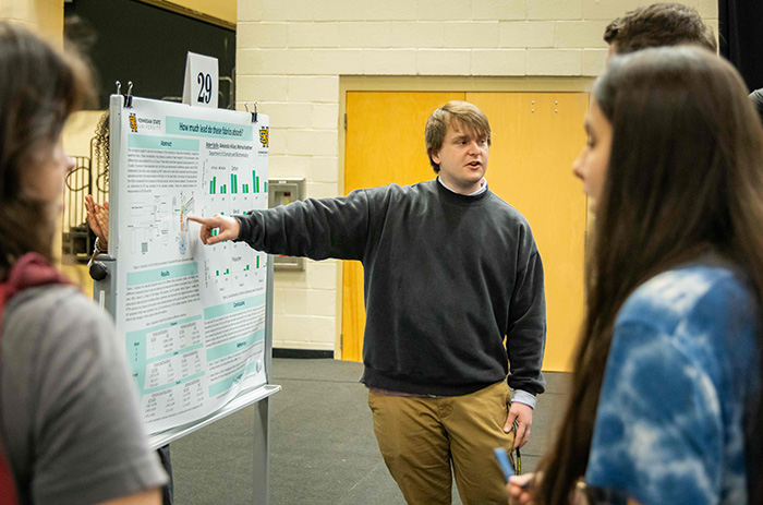 student with poster presentation