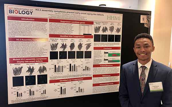 Trae presenting at MIT during the summer program in 2019.  