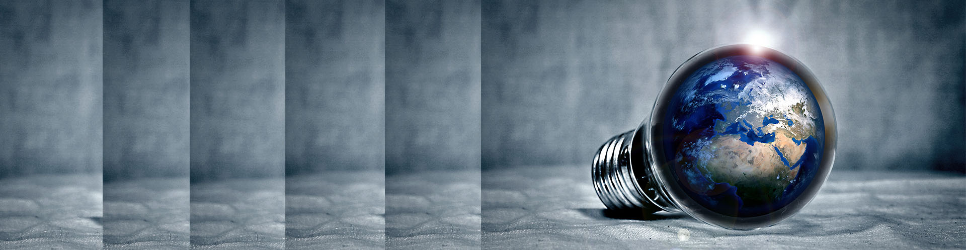 a light bulb with the reflection of the world from a distance.