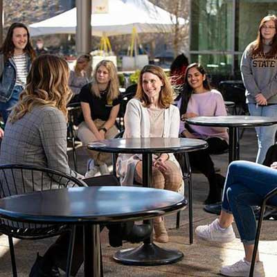 group of students listening to mentor