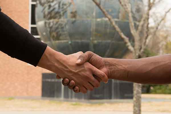 two people shaking hands