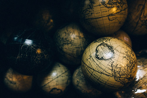 Image of old world globes stacked 