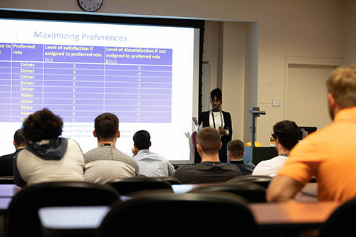 Student giving an oral presentation at a conference