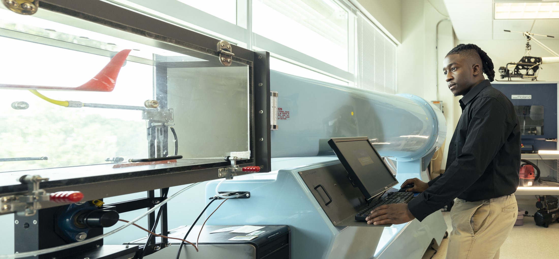 a person testing an engineering part in a lab